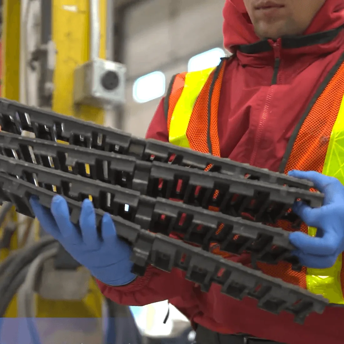 Worker holding an assembled trench drain channel and grate